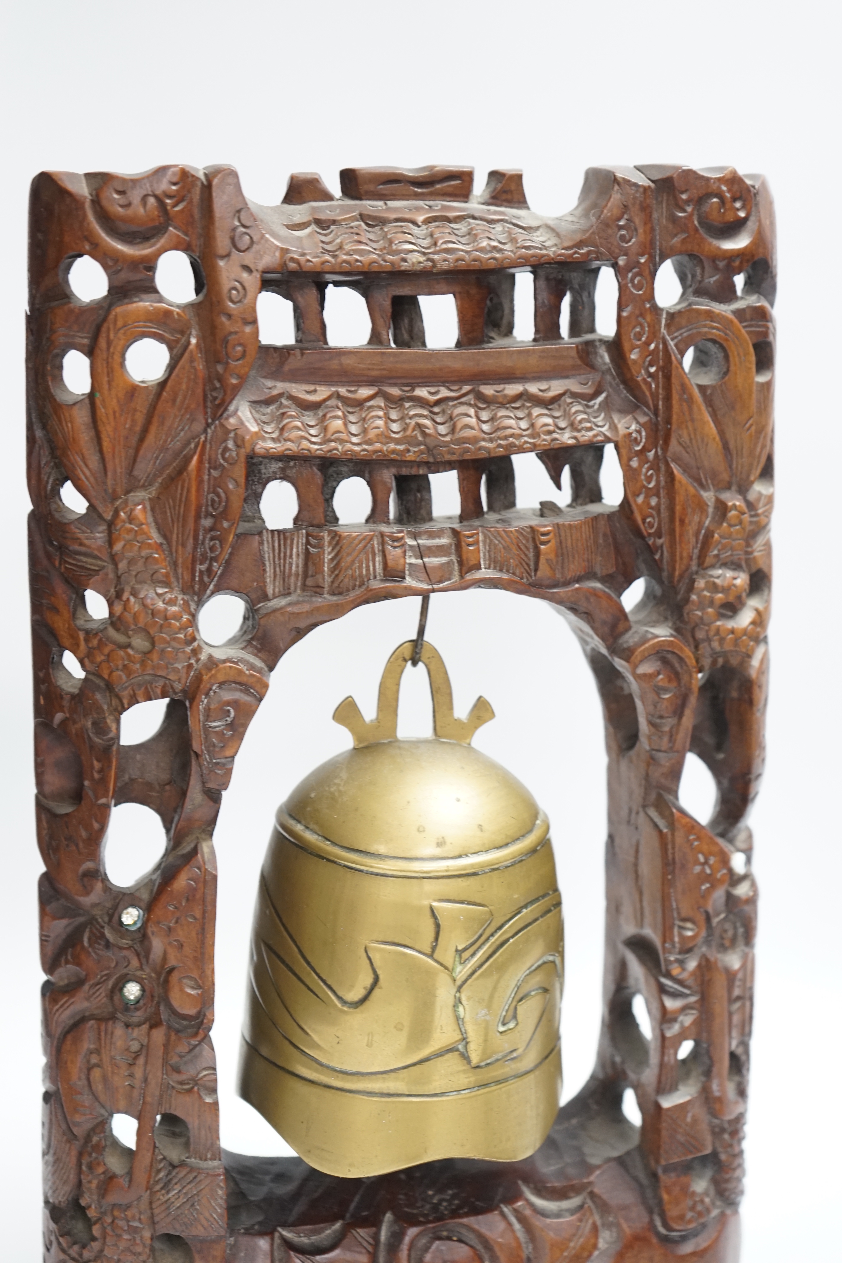 A Chinese table bell, pewter tea canister and an Indian ‘cobra’ hook, bell in frame 34.5cm high